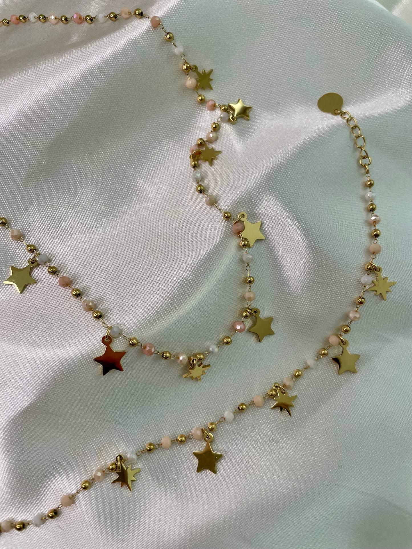 BRACCIALE CON STELLE E PERLINE